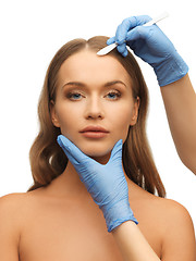 Image showing woman face and beautician hands