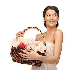 Image showing woman with basket full of flowers