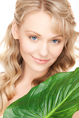 Image showing woman with green leaf