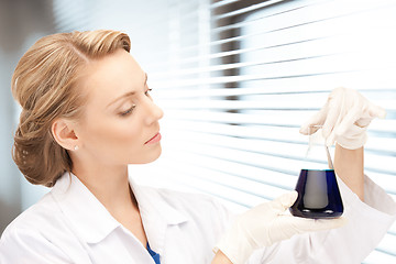 Image showing lab worker holding up test tube