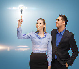 Image showing man and woman with light bulb