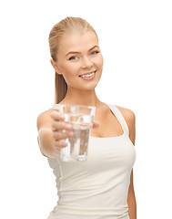 Image showing young smiling woman with glass of water