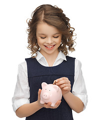 Image showing girl with piggy bank