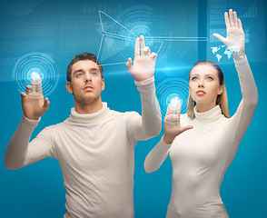 Image showing man and woman working with virtual screens