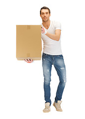 Image showing handsome man with big box