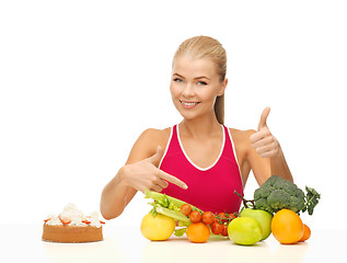 Image showing woman pointing at healthy food