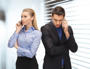 Image showing man and woman with cell phones