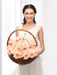 Image showing woman with basket full of flowers