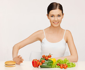 Image showing woman with hamburger and vegetables