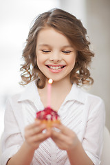 Image showing girl with cupcake