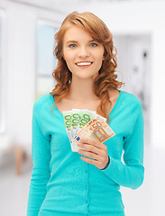 Image showing happy teenage girl with euro cash money