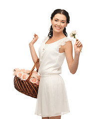 Image showing woman with basket full of flowers