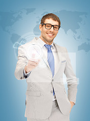 Image showing businessman pressing virtual button