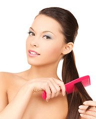 Image showing beautiful woman with comb