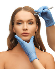 Image showing woman face and beautician hands