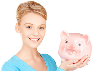 Image showing lovely woman with piggy bank