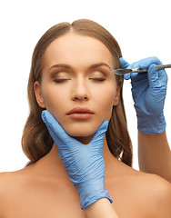 Image showing woman face and beautician hands