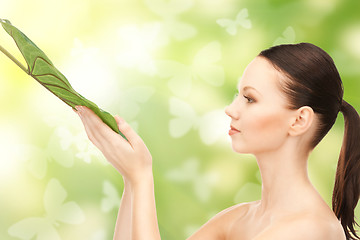 Image showing woman with green leaf