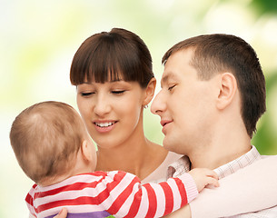 Image showing happy mother and father with adorable baby