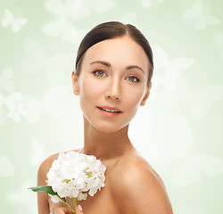 Image showing beautiful woman with white flower