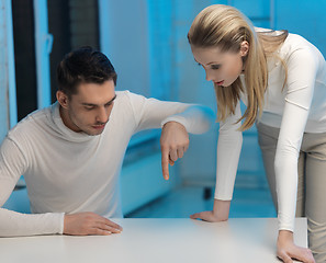 Image showing man and woman working with something