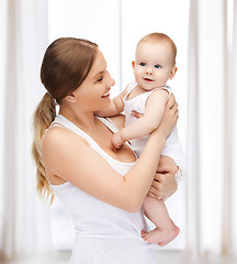 Image showing happy mother with adorable baby