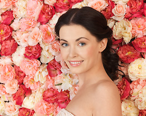 Image showing woman with background full of roses