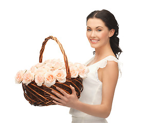 Image showing woman with basket full of flowers