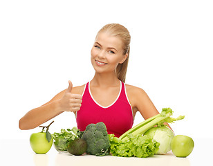 Image showing woman shows thumbs up with organic food