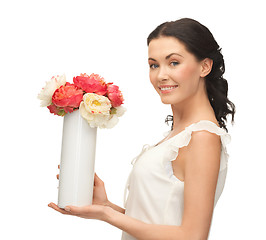 Image showing woman with vase of flowers