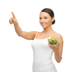 Image showing healthy woman holding bowl with salad