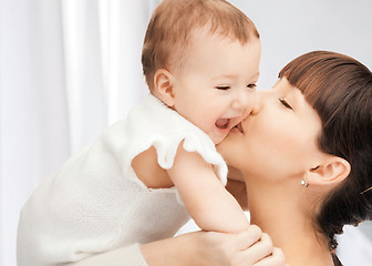 Image showing happy mother with adorable baby