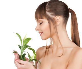 Image showing woman with green sprout