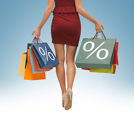 Image showing long legs with shopping bags