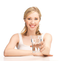 Image showing young smiling woman with glass of water