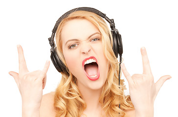 Image showing woman with headphones showing rock n roll sign