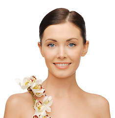Image showing lovely woman with orchid flower