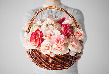 Image showing man holding basket full of flowers