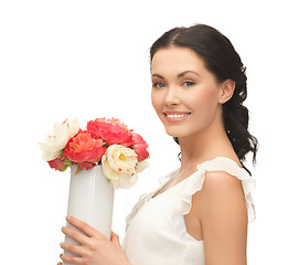 Image showing woman with vase of flowers