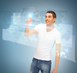 Image showing man touching virtual screen