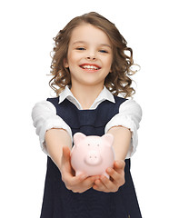 Image showing girl with piggy bank