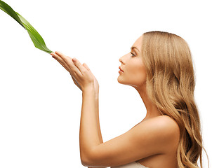 Image showing woman with green leaf