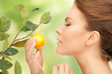 Image showing lovely woman with lemon twig