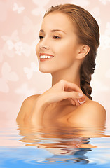Image showing beautiful woman with butterflies in water