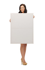 Image showing lovely woman in blue dress with blank board