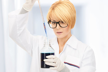 Image showing lab worker holding up test tube