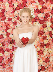 Image showing woman with heart and background full of roses