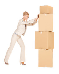 Image showing businesswoman with big boxes