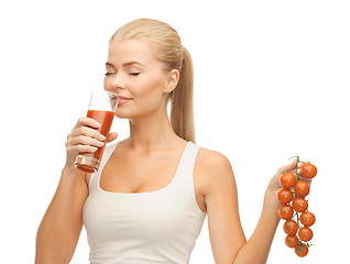 Image showing woman drinking tomato juice