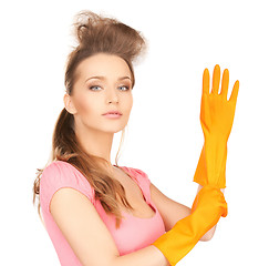 Image showing housewife with protective gloves